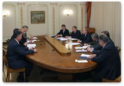 Prime Minister Vladimir Putin meets with Chevron Chairman and CEO John Watson