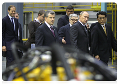 Prime Minister Vladimir Putin during his trip to the Yaroslavl Region touring a new production facility owned by leading Japanese construction equipment manufacturer Komatsu|18 june, 2010|17:35