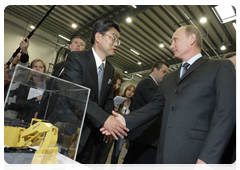 Prime Minister Vladimir Putin during his trip to the Yaroslavl Region touring a new production facility owned by leading Japanese construction equipment manufacturer Komatsu|18 june, 2010|17:35