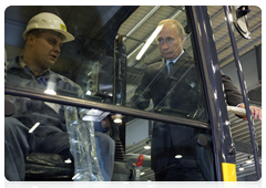 Prime Minister Vladimir Putin during his trip to the Yaroslavl Region touring a new production facility owned by leading Japanese construction equipment manufacturer Komatsu|18 june, 2010|17:35