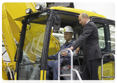 Prime Minister Vladimir Putin during his trip to the Yaroslavl Region touring a new production facility owned by leading Japanese construction equipment manufacturer Komatsu|18 june, 2010|17:35