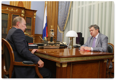 Russian Prime Minister Vladimir Putin meets with Alexander Surinov, the head of the Federal Service for State Statistics