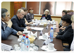 Vladimir Putin  with the families of miners and rescue workers ho were killed in the Novokuznetsk mine blasts|24 june, 2010|14:42