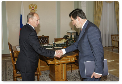 Prime Minister Vladimir Putin meets with head of the Federal Insurance Supervision Service Alexander Koval