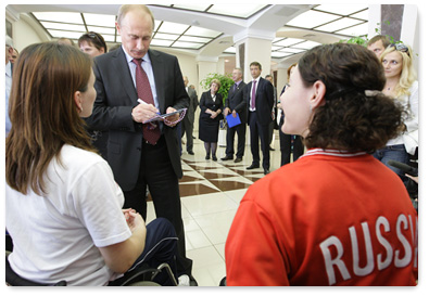 Prime Minister Vladimir Putin meets with the Russian Paralympic fencing team