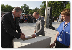 Prime Minister Vladimir Putin and President of the International Olympic Committee (IOC) Jacques Rogge take part in the foundation stone ceremony for the Russian International Olympic University