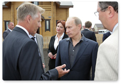 Prime Minister Vladimir Putin tours the construction site of the Solnechny housing complex in the village of Pushkari, Tambov Region