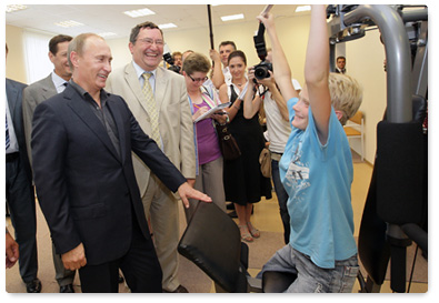 Prime Minister Vladimir Putin visits a community centre in the village of Tulinovka, Tambov Region