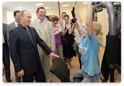 Prime Minister Vladimir Putin visits a community centre in the village of Tulinovka, Tambov Region