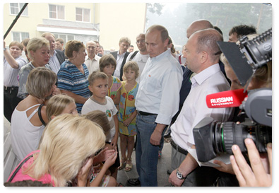 Prime Minister Vladimir Putin inspects the accommodations for evacuees from areas affected by wildfires