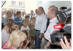 Prime Minister Vladimir Putin inspects the accommodations for evacuees from areas affected by wildfires