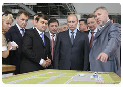 Prime Minister Vladimir Putin inspecting plans for airport construction and renovation during his visit to North Caucasus Federal District|7 july, 2010|16:14