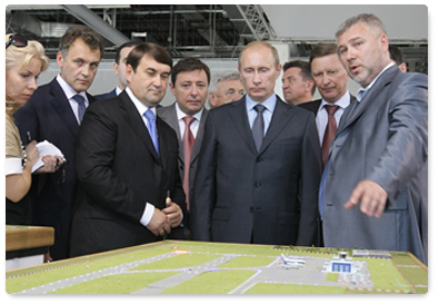 During his visit to the North Caucasus Federal District, Prime Minister Vladimir Putin inspects plans for the construction and renovation of airports