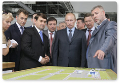 During his visit to the North Caucasus Federal District, Prime Minister Vladimir Putin inspects plans for the construction and renovation of airports