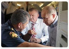 Prime Minister Vladimir Putin on aboard a Be-200 amphibious aircraft|10 august, 2010|18:10