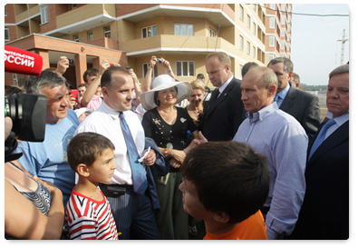 Prime Minister Vladimir Putin inspects the construction of housing in the Podolsk District of the Moscow Region