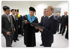 Prime Minister Vladimir Putin receives an honorary degree in Judo from Yong In University in South Korea