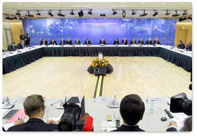 Prime Minister Vladimir Putin attends round table discussion on issues of the timber industry