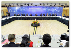 Prime Minister Vladimir Putin attends round table discussion on issues of the timber industry