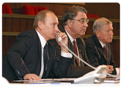 Prime Minister Vladimir Putin holding a video conference with the crew of the International Space Station while touring the Mission Control Centre and the Central Research and Development Institute for Engineering in the Moscow Region town of Korolyov|11 january, 2011|17:01