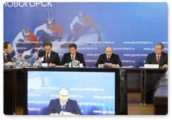 Prime Minister Vladimir Putin chairs a meeting on Russia’s sport and fitness strategy through 2020 in Novogorsk, outside Moscow