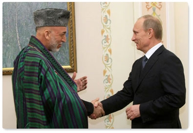 Prime Minister Vladimir Putin meets with Afghan President Hamid Karzai