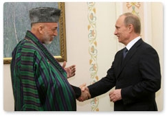 Prime Minister Vladimir Putin meets with Afghan President Hamid Karzai