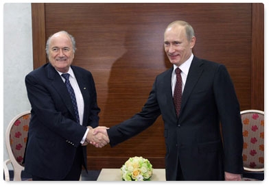 Prime Minister Vladimir Putin meets with FIFA president Joseph Blatter in the Leningrad Region