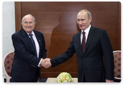 Prime Minister Vladimir Putin meets with FIFA president Joseph Blatter in the Leningrad Region