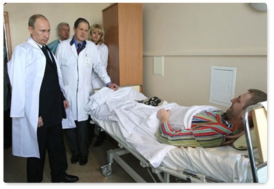 Russian Prime Minister Vladimir Putin visits the victims of the Domodedovo airport terrorist attack at the Vishnevsky Surgery Institute