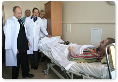 Russian Prime Minister Vladimir Putin visits the victims of the Domodedovo airport terrorist attack at the Vishnevsky Surgery Institute