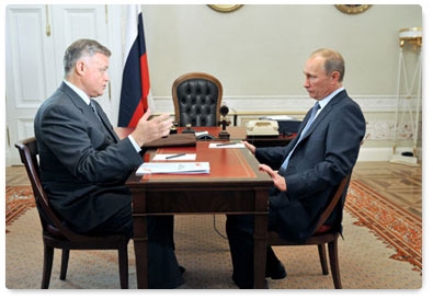 Prime Minister Vladimir Putin meets with Russian Railways President Vladimir Yakunin during a trip to St Petersburg