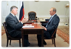 Prime Minister Vladimir Putin meets with Russian Railways President Vladimir Yakunin during a trip to St Petersburg