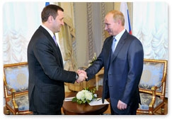 Russian Prime Minister Vladimir Putin meets with Moldovan Prime Minister Vladimir Filat