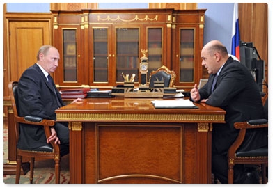 Prime Minister Vladimir Putin meets with Federal Tax Service head Mikhail Mishustin