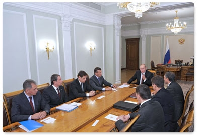 Prime Minister Vladimir Putin presents State Duma candidate certificates to a number of ministers