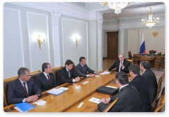 Prime Minister Vladimir Putin presents State Duma candidate certificates to a number of ministers