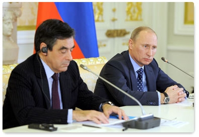 Prime Minister Vladimir Putin and his French counterpart, Francois Fillon, hold joint news conference