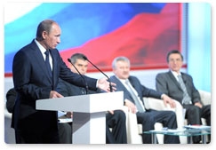 Prime Minister Vladimir Putin takes part in the National Transport Conference plenary session in Novosibirsk