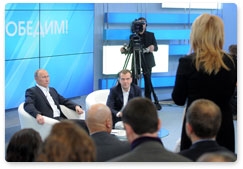 President Dmitry Medvedev and Prime Minister Vladimir Putin meet with voters