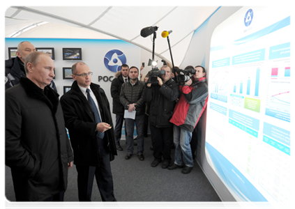 Prime Minister Vladimir Putin visits display stands featuring information on the Kalininskaya Nuclear Power Plant construction, prior to the commissioning ceremony of the plant's fourth unit|12 december, 2011|16:11