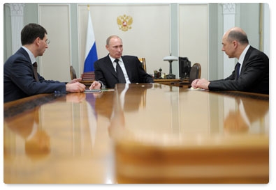 Prime Minister Vladimir Putin meets with Finance Minister Anton Siluanov and Minister of Communications and Mass Media Igor Shchegolev