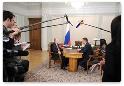 Prime Minister Vladimir Putin meets with Gazprom CEO Alexei Miller