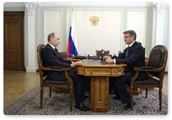 Prime Minister Vladimir Putin meets with Sberbank CEO German Gref