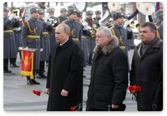 Prime Minister Vladimir Putin attends the wreath-laying ceremony at the Tomb of the Unknown Soldier in Alexander Garden