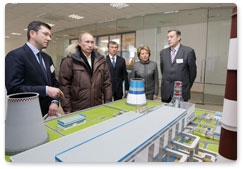 Prime Minister Vladimir Putin visits Southern Combined Heat and Power Station 22 during his visit to St Petersburg and inspects its recently completed power-generating unit