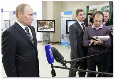 Prime Minister Vladimir Putin gives a news conference during his working visit to the Tomsk Region