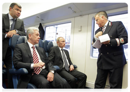 Prime Minister Vladimir Putin continues discussing the development of the Moscow air traffic hub while on a shuttle train from Sheremetyevo Airport back to Moscow|28 march, 2011|20:56