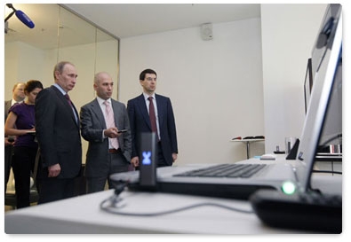 Prime Minister Vladimir Putin examines new developments in the telecommunications sector