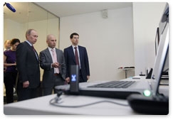 Prime Minister Vladimir Putin examines new developments in the telecommunications sector